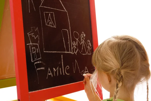 Bambino che disegna sulla tavola — Foto Stock