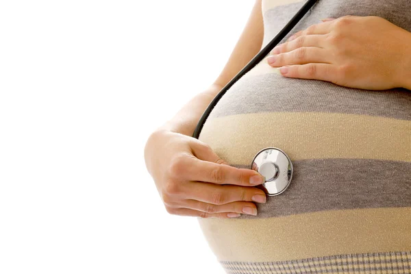 Pregnant woman with a stethoscope — Stock Photo, Image