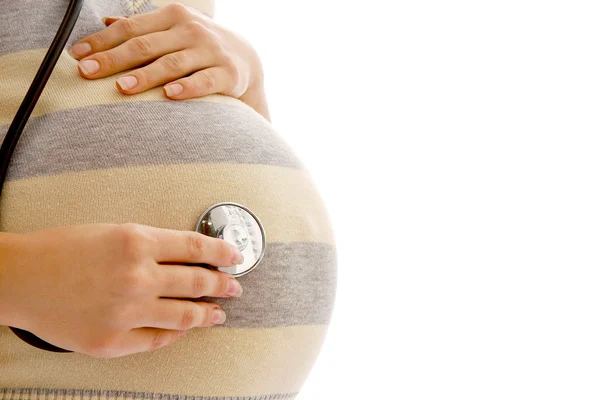 Pregnant woman with a stethoscope — Stock Photo, Image