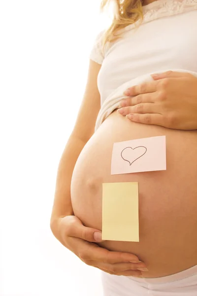 Pregnant woman with stickers — Stock Photo, Image