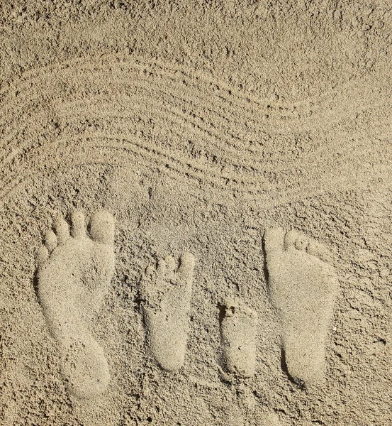 Rodinné nohy na písku — Stock fotografie
