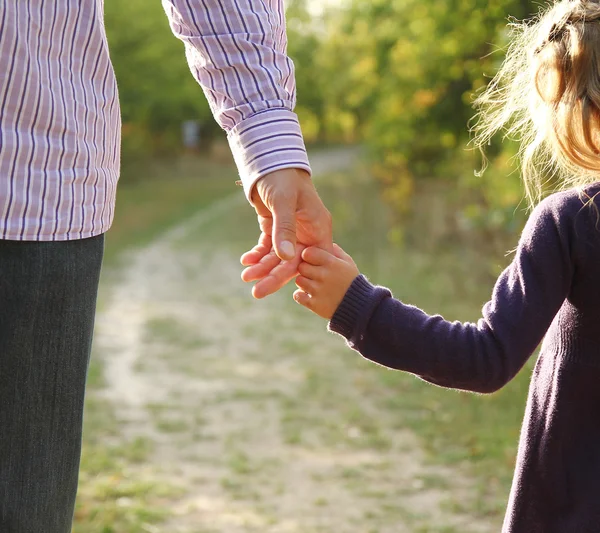 Parent holds hand of child — Stock Photo, Image