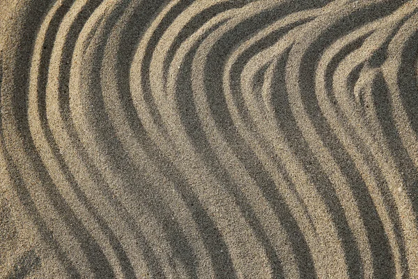 Golven op het strand zand achtergrond — Stockfoto