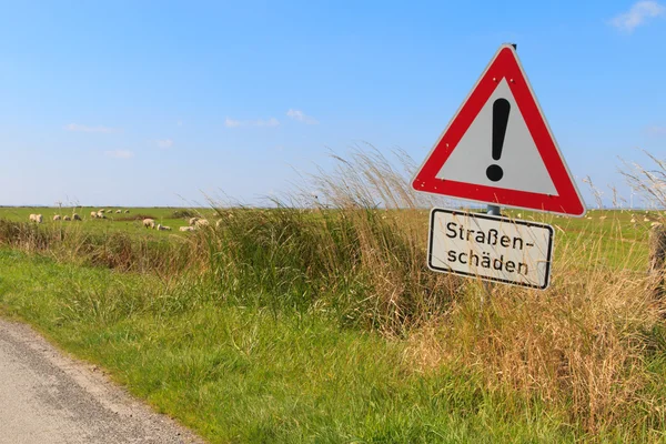 German road sign warning of road damage — Stock Photo, Image