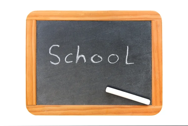 School written on vintage chalkboard and a chalk on the board — Stock Photo, Image