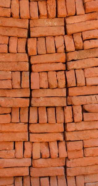 堆叠的橙色砖块的供应 — 图库照片