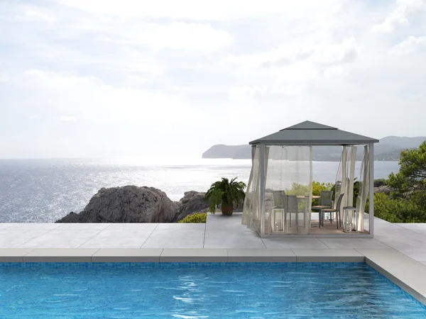 Swimming pool, pavilion and the sea — Stockfoto