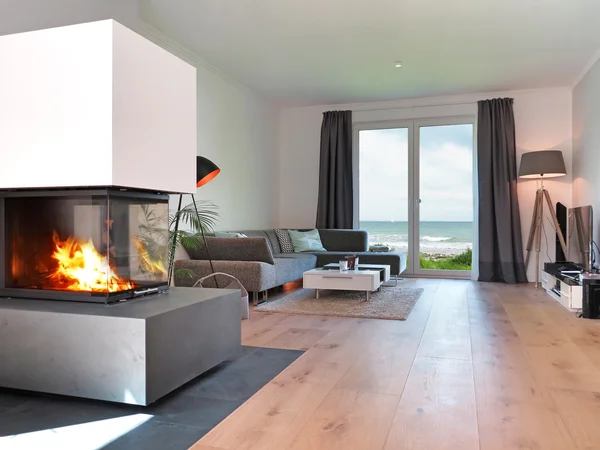 Modern living room with a view to the sea — Stockfoto