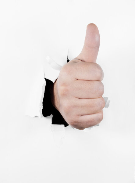 Hand with thumb up in approval gesture