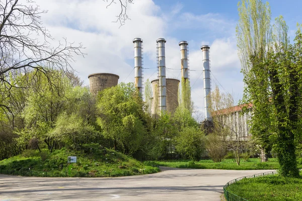 Power plant in spring green landscape — Stock Photo, Image