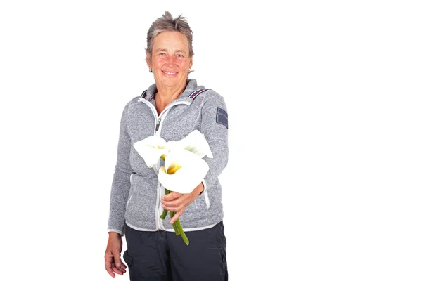 Mature woman with callas — Stock Photo, Image