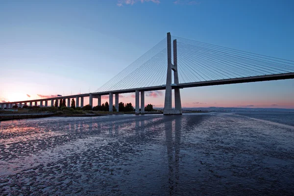 Vasco da gama bridge at sunset — стоковое фото