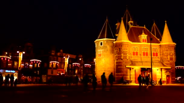 Medieval De Waag building in Amsterdam, Netherlands by night — Stock Video