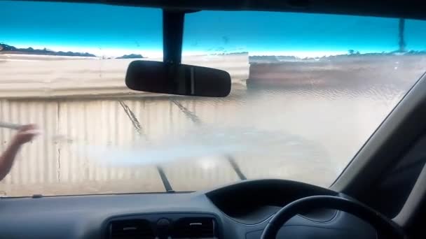 African Man Washing Car Windshield Wipers Using Pressure Washer Footage — Αρχείο Βίντεο