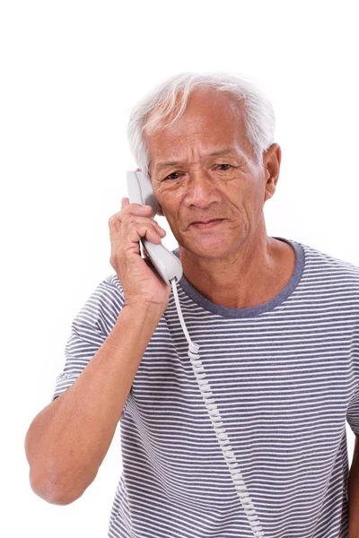 Trist, frustreret, negativ ældre mand taler via telefon - Stock-foto