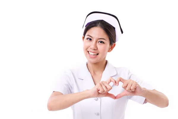Uśmiechający się pielęgniarka co serce symbol ręką gest — Zdjęcie stockowe