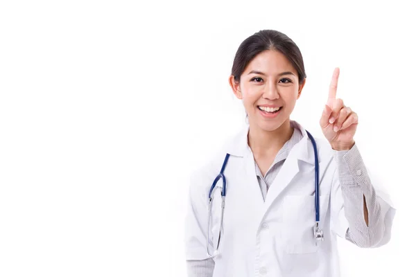 Женщина-врач, указывающая пальцем вверх — стоковое фото