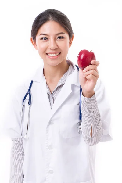 Жінка-лікар з рукою тримає червоне яблуко, концепція здорового фо — стокове фото