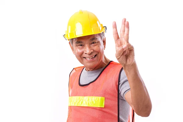 Gelukkig, glimlachen bouwvakker omhoog 3 vingers gebaar — Stockfoto