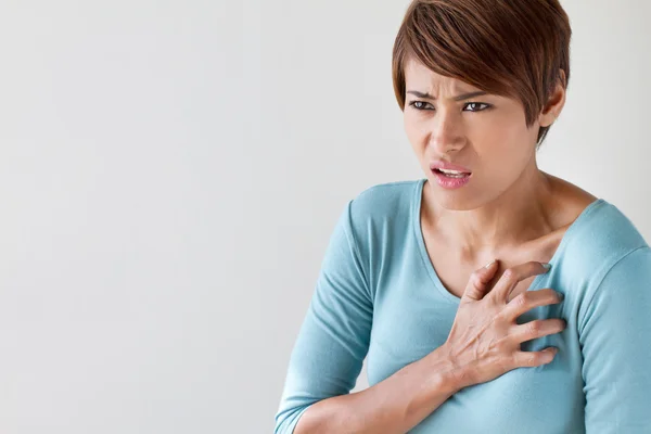 Sick woman with sudden heart attack symptom — Stock Photo, Image