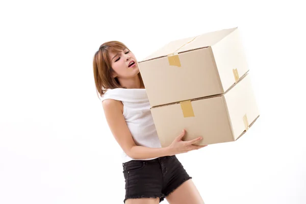 Unhappy woman carrying heavy box with back pain — Stock Photo, Image