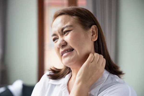 itching woman scratching her neck skin due to eczema, ringworm, allergic skin, atopic dermatitis symptoms