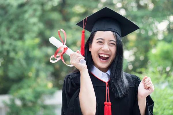 happy excited college student graduating; concept of successful education, happy commencement day, woman education equality, employment opportunity, high education degree, overseas study scholarships