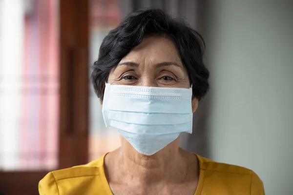 old senior woman wearing face mask, concept of mouth and nose covering face mask wearing, fine dust pollution, air pollution, COVID-19 contagious disease preventive medicine