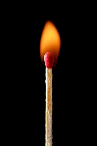 Burning match isolated on black background — Stock Photo, Image