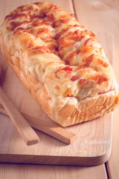 Bread ham cheese with hand with filter effect retro vintage style — Stock Photo, Image