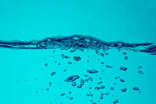 Бульбашки блакитного водного фону — стокове фото