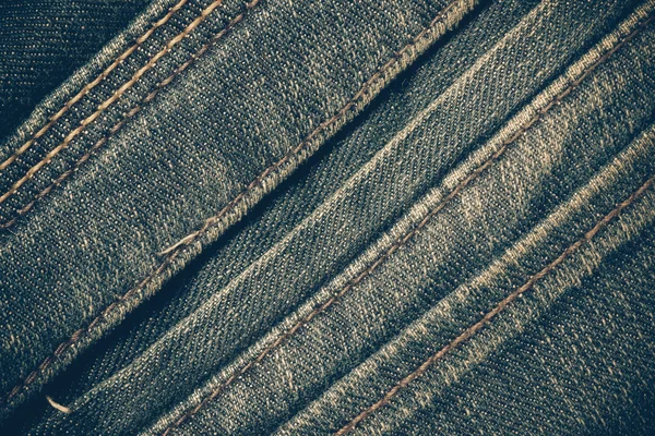 Текстура синих джинсов фон с эффектом фильтра ретро-винтаг — стоковое фото