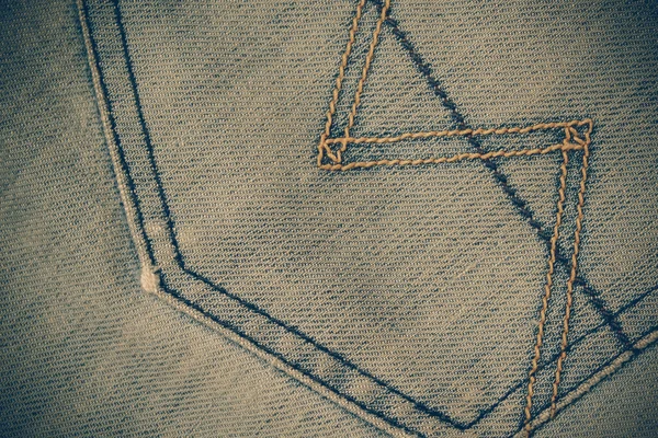 Konsistens av Blå jeans bakgrund med filter effekt retro vintag — Stockfoto