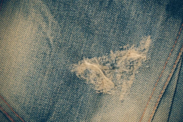 Texture de fond de jeans bleu avec effet filtre rétro vintag — Photo