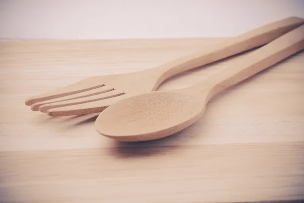 Wooden spoon on wood table with filter effect retro vintage styl — Stock Photo, Image