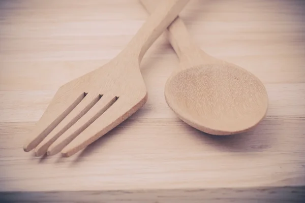 Wooden spoon on wood table with filter effect retro vintage styl — Stock Photo, Image