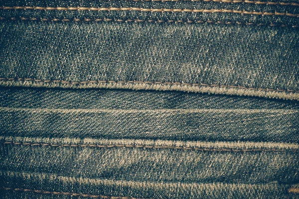 Текстура синих джинсов фон с эффектом фильтра ретро-винтаг — стоковое фото