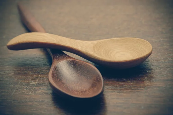 Wooden spoon on wood table with filter effect retro vintage styl — Stock Photo, Image