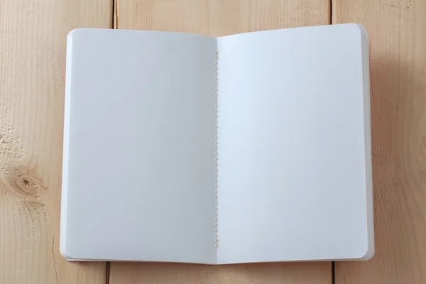 Recycled paper book on wooden background
