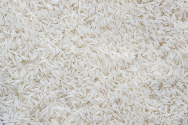 Bianco lungo riso sfondo texture — Foto Stock