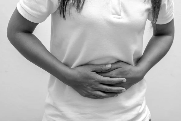 Blabk and white Woman Suffering From Stomach Ache — Stock Photo, Image