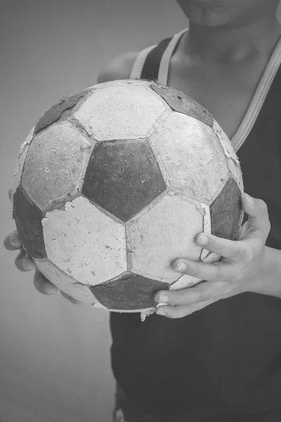 Children hold the old football with filter effect blabk and white style — Stock Photo, Image