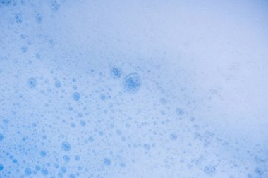 Soyut arka plan beyaz sabunlu köpük dokusu. Köpüklü şampuan köpüğü.