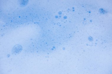 Soyut arka plan beyaz sabunlu köpük dokusu. Köpüklü şampuan köpüğü.