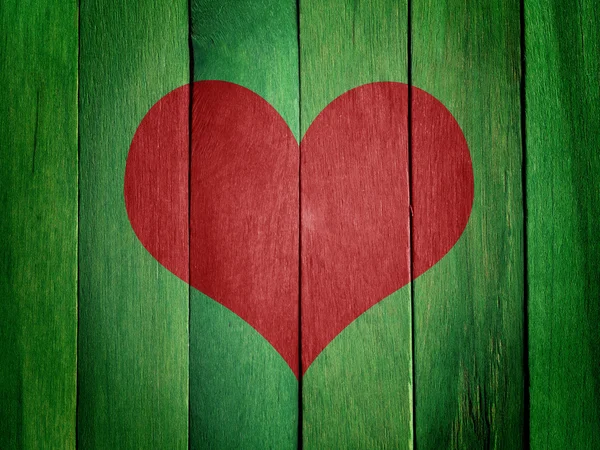 Corazón sobre fondo de madera verde — Foto de Stock