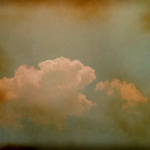 Sky, fog, and clouds on a textured, vintage paper background with grunge stains — Stock Photo, Image