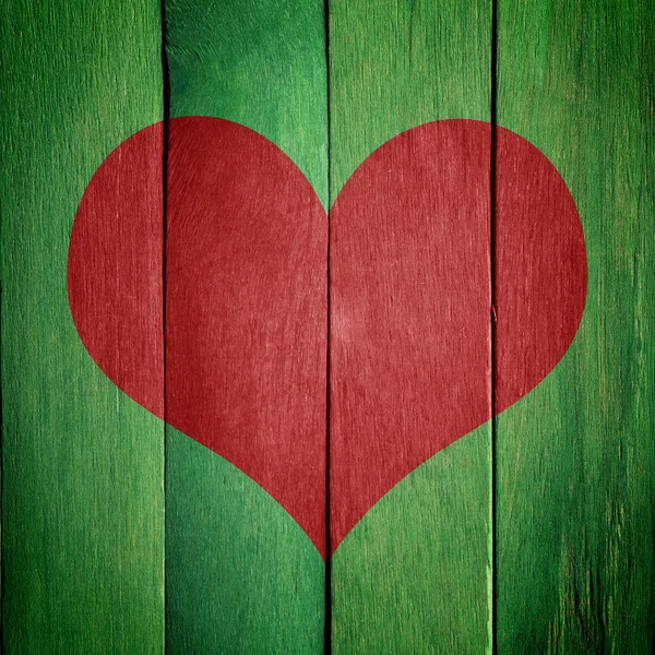 Corazón sobre fondo de madera verde — Foto de Stock