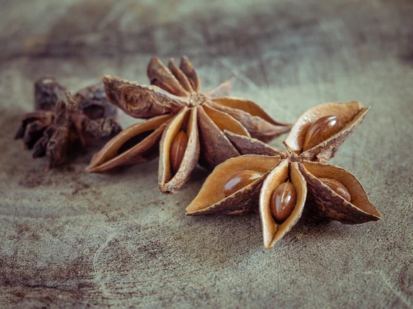 Star anise on rustic wood background — Stock Photo, Image