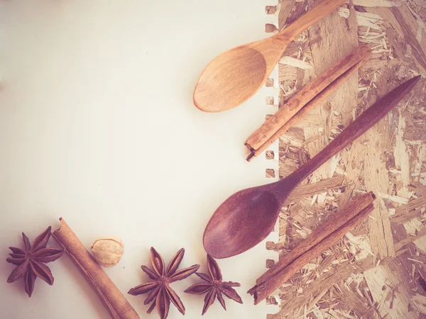 Wooden spoons on a wooden background with filter effect retro vintage style — Stock Photo, Image