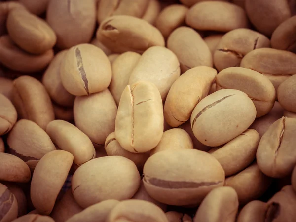 Green coffee beans macro with filter effect retro vintage style — Stock Photo, Image